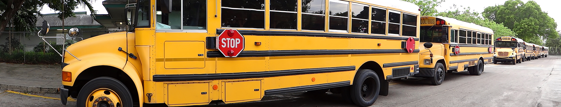 safe driving in school zones blog post banner, yellow school bus